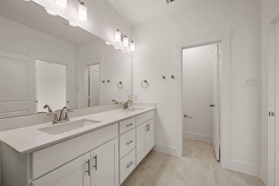 You'll find ample room for two in this stylish owner's bath!