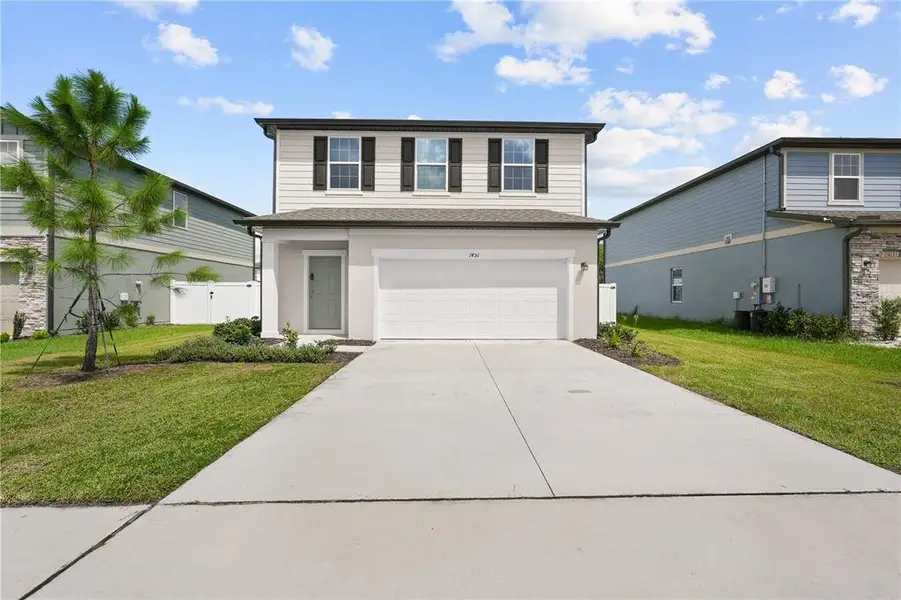 Front exterior of a new home in Belair Place, Sanford, FL, highlighting curb appeal (Image 26).