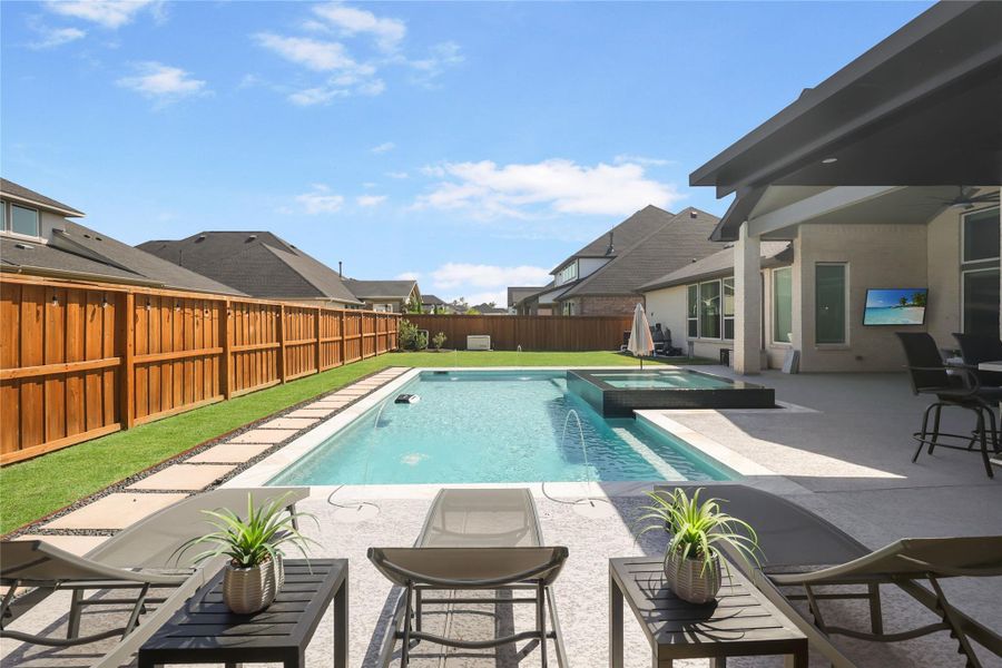 Exterior details and patio area of a home in Woodson’s Reserve, Spring (Image 32).