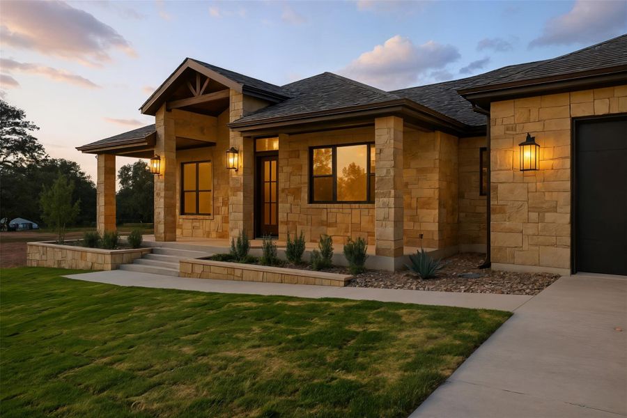 View of front of property with a front yard and stone siding View of front of property with a front yard and stone siding
