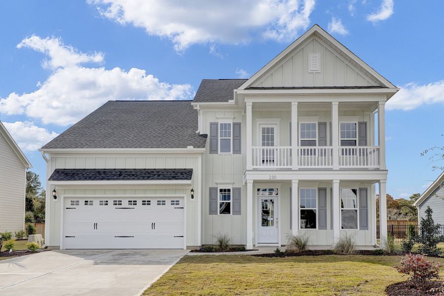 Front exterior of a new home in East Wynd, Hampstead, NC, highlighting curb appeal (Image 1).