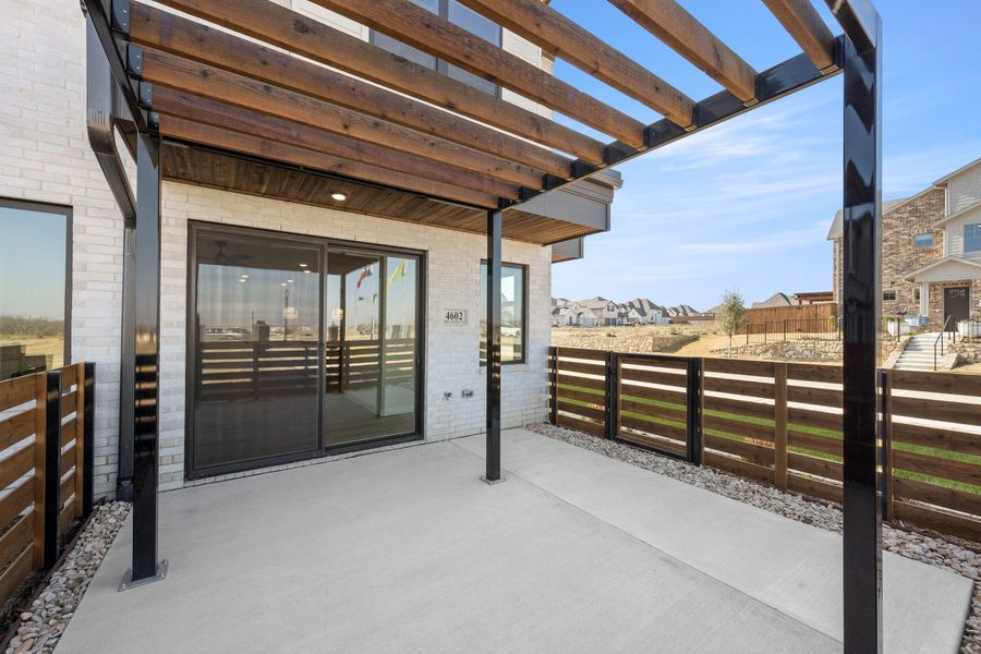 Exterior details and patio area of a home in Wildridge, Oak Point (Image 3).