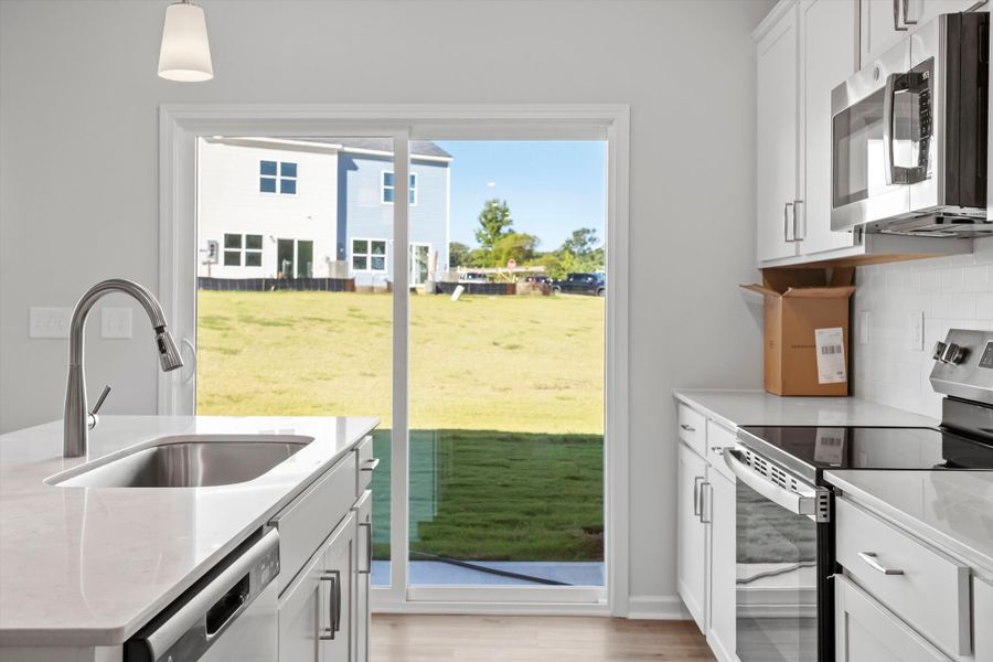 Furnished interior view inside a new home in West Main Townhomes, Sanford (Image 7).