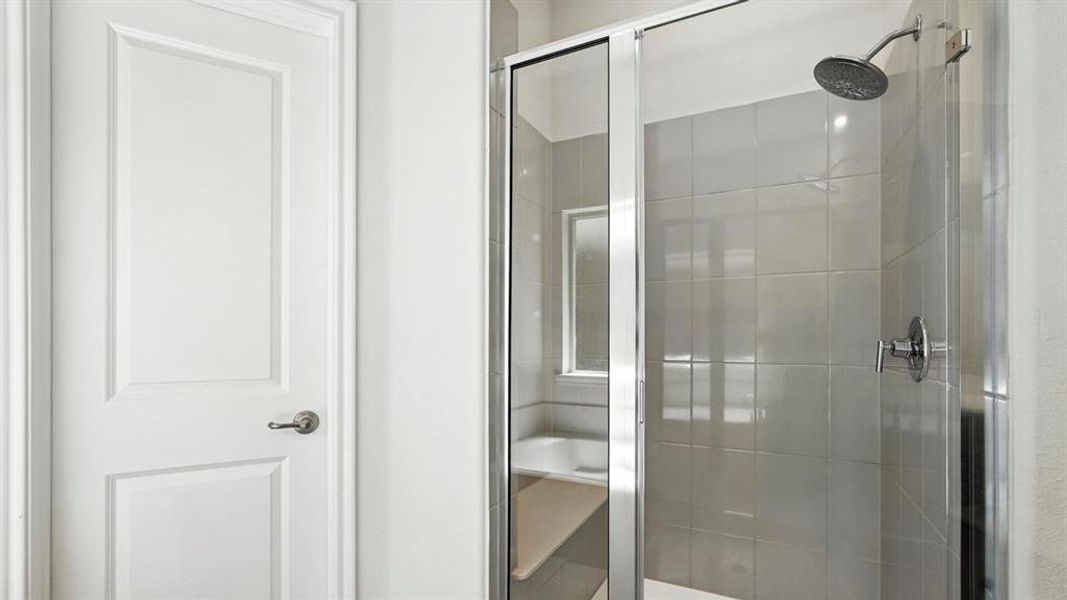 Bathroom featuring a shower stall