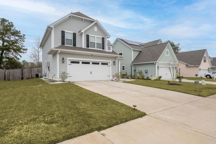 Front exterior of a new home in Abbey Walk, Moncks Corner, SC, highlighting curb appeal (Image 24). Front exterior of a new home in Abbey Walk, Moncks Corner, SC, highlighting curb appeal (Image 24).