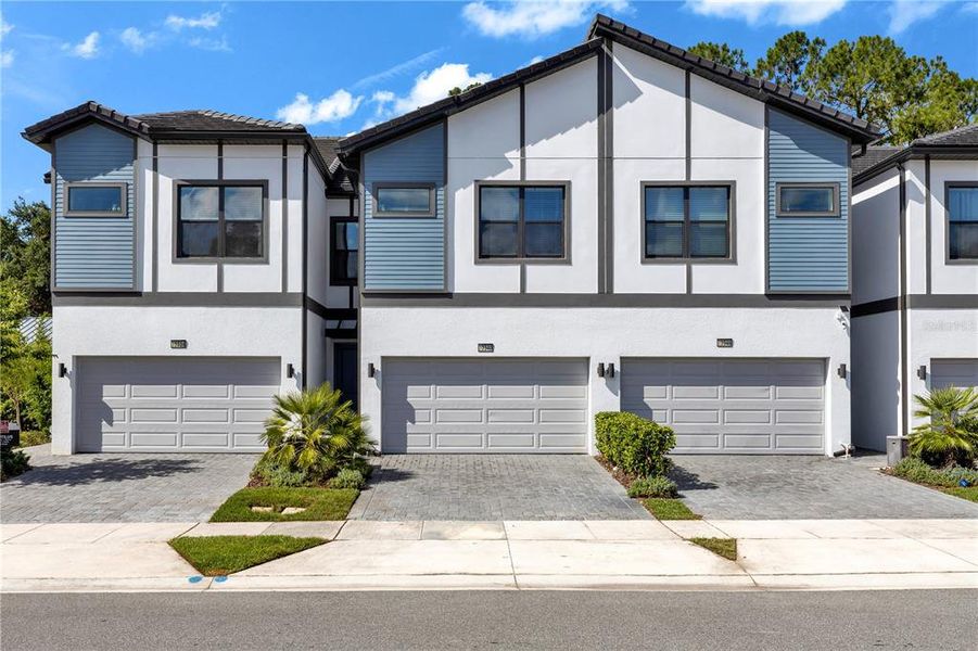 Front exterior of a new home in , Orlando, FL, highlighting curb appeal (Image 1). Front exterior of a new home in , Orlando, FL, highlighting curb appeal (Image 1).