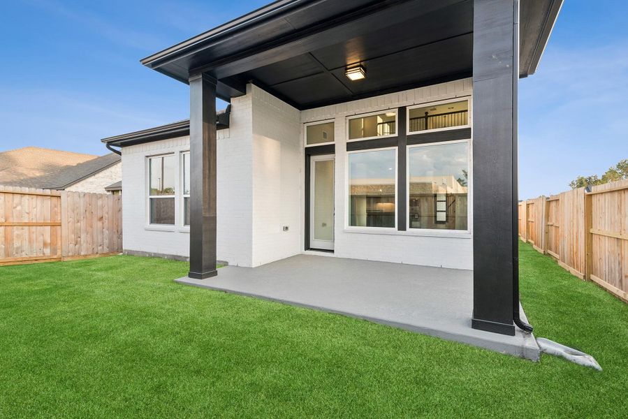 Exterior details and patio area of a home in The Highlands - Grove Collection, Porter (Image 26).