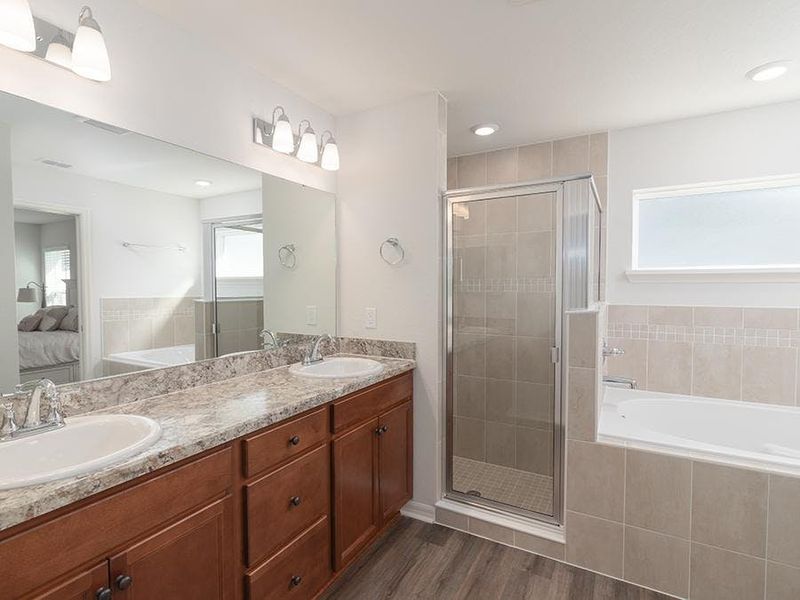 Your suite is complete with a walk-in wardrobe and luxurious en-suite bath.