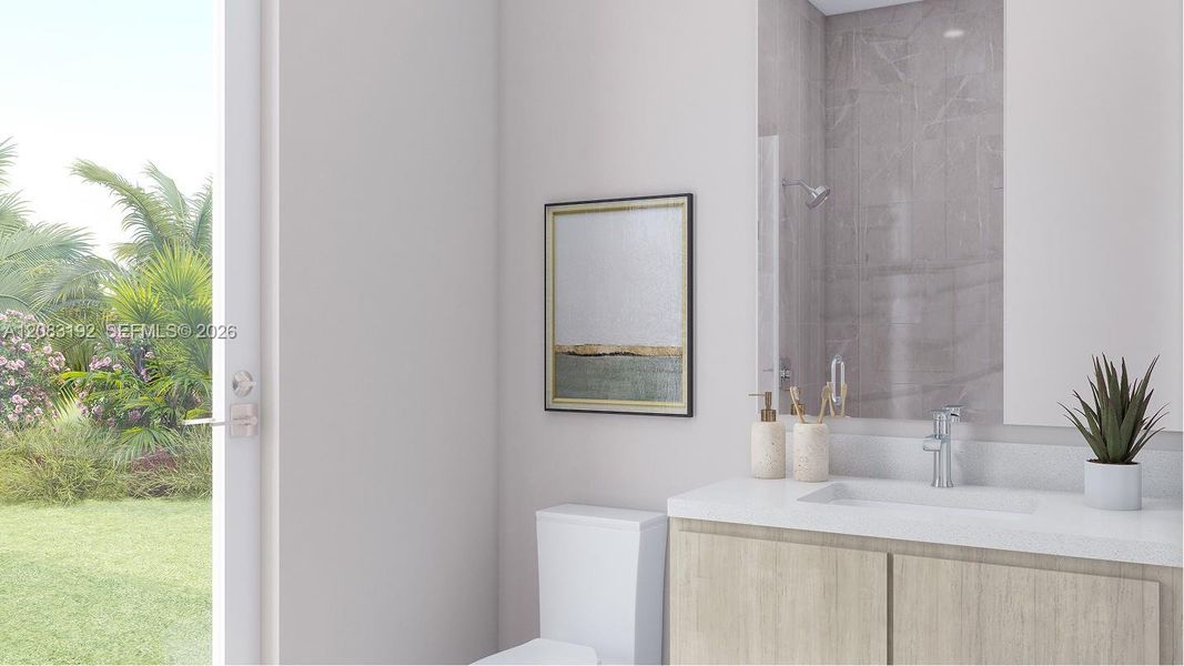 This en-suite bathroom also enjoys direct access to the backyard.