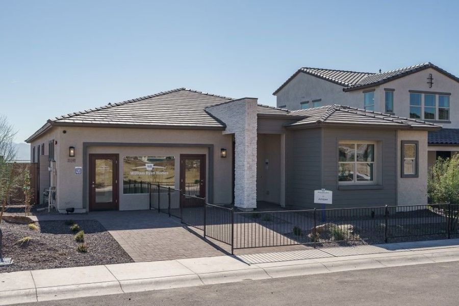Front exterior of a new home in The Ridge at Sienna Hills, Buckeye, AZ, highlighting curb appeal (Image 22).