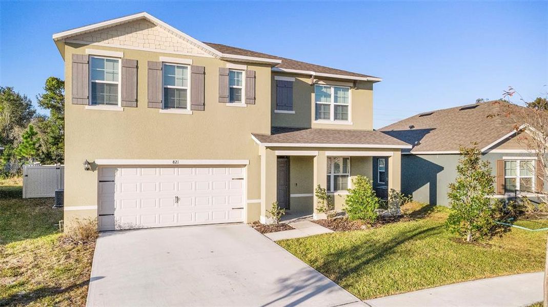 Front exterior of a new home in Cadence at Parc Hill, Orange City, FL, highlighting curb appeal (Image 23).