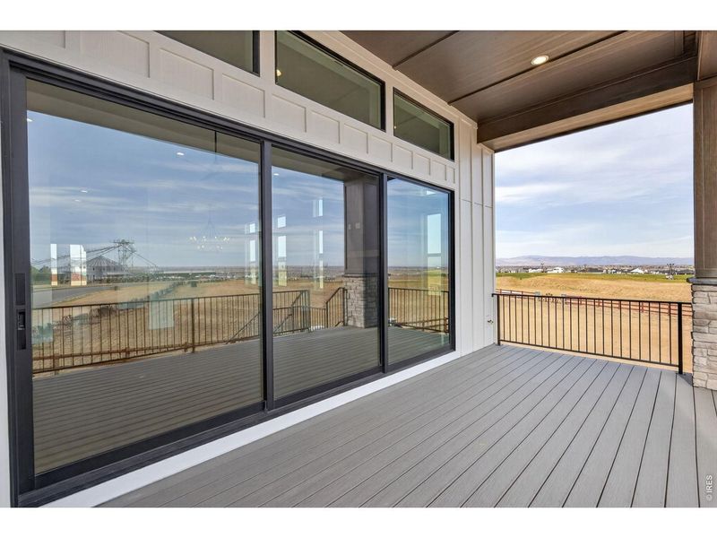 Exterior details and patio area of a home in RainDance, Windsor (Image 26).