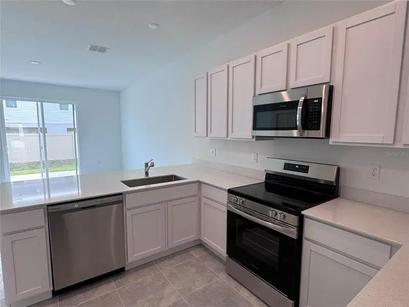 Furnished interior view inside a new home in , Kissimmee (Image 7).