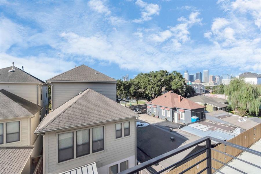 Rooftop deck overlooking downtown skyline view.