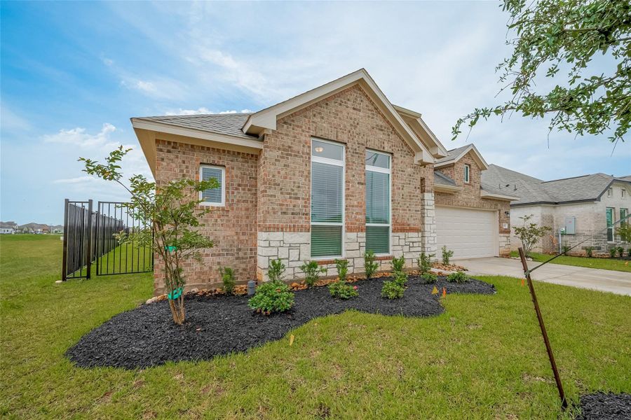 Front exterior of a new home in Lago Mar, Texas City, TX, highlighting curb appeal (Image 23). Front exterior of a new home in Lago Mar, Texas City, TX, highlighting curb appeal (Image 23).