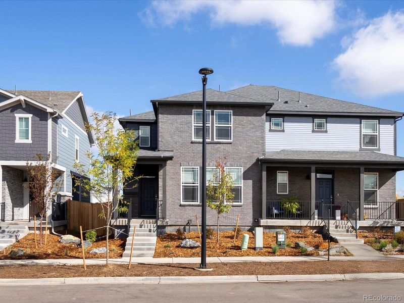Front exterior of a new home in Horizon Uptown: The Mountain Collection, Aurora, CO, highlighting curb appeal (Image 18). Front exterior of a new home in Horizon Uptown: The Mountain Collection, Aurora, CO, highlighting curb appeal (Image 18).