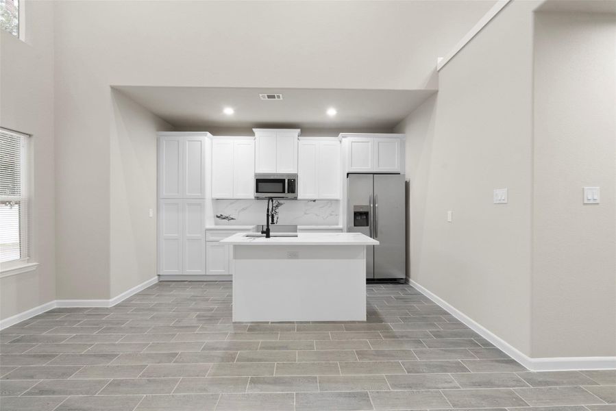View from living room to kitchen and breakfast bar View from living room to kitchen and breakfast bar