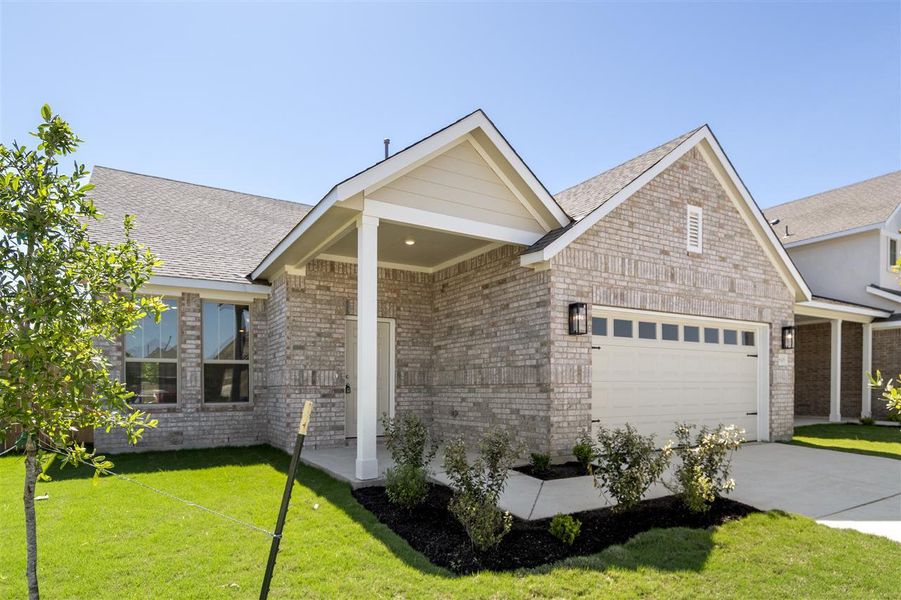 View of front of home featuring a garage, brick siding, a front lawn, and concrete driveway View of front of home featuring a garage, brick siding, a front lawn, and concrete driveway