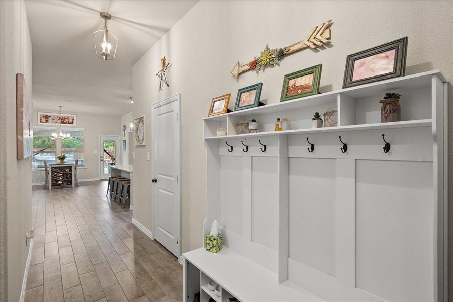 Front entry features mud bench for keeping everything organized