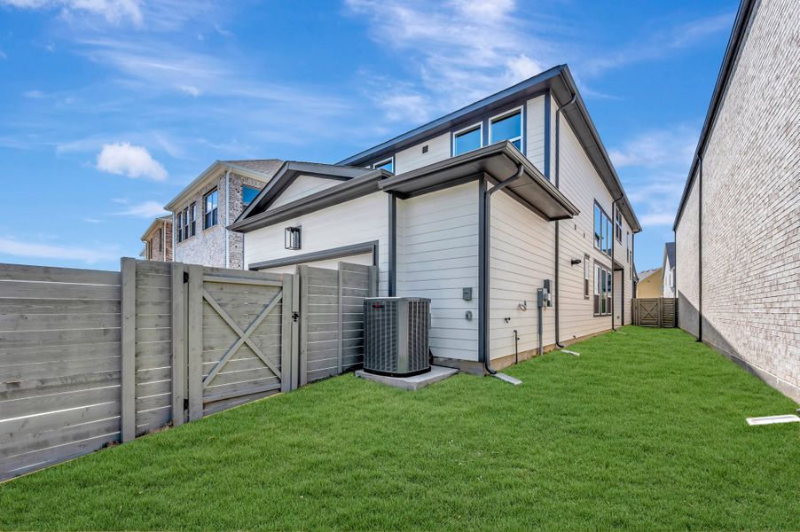 Exterior details and patio area of a home in The Retreat at Harvest, Argyle (Image 3).
