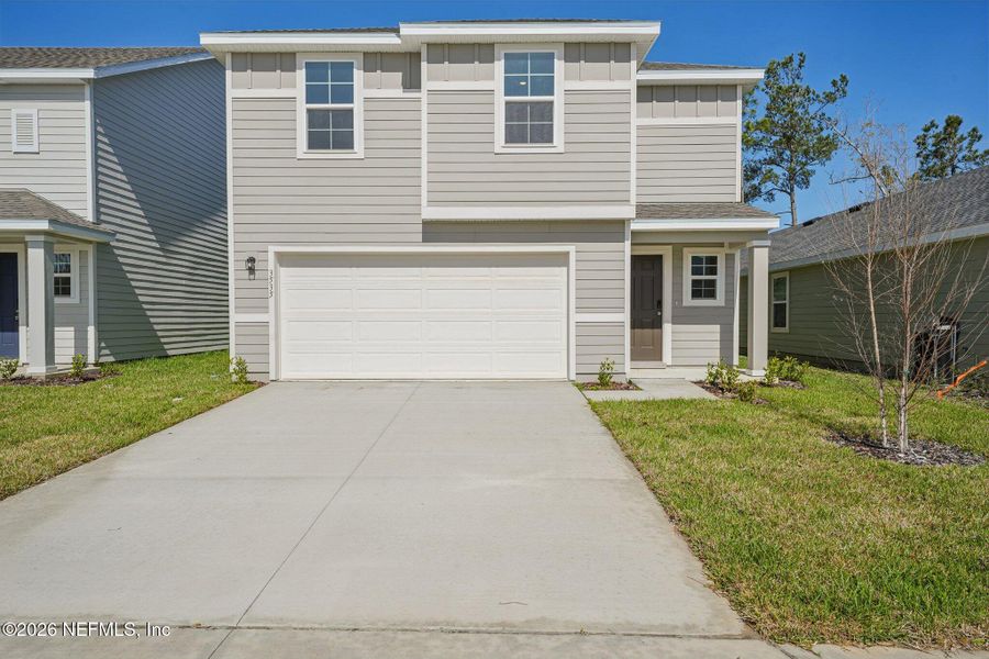 Front exterior of a new home in Kings Landing, Jacksonville, FL, highlighting curb appeal (Image 25).