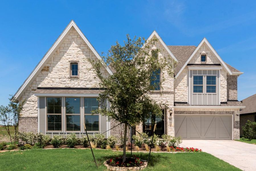 Representative exterior photo of a completed home built from the Grand Silverwood by Grand Homes in Edgewater, Fate, TX (Image 2). Representative exterior photo of a completed home built from the Grand Silverwood by Grand Homes in Edgewater, Fate, TX (Image 2).