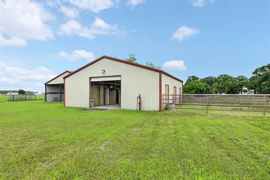 3 stall barn with outdoor stalls and separate equipment or storage shed