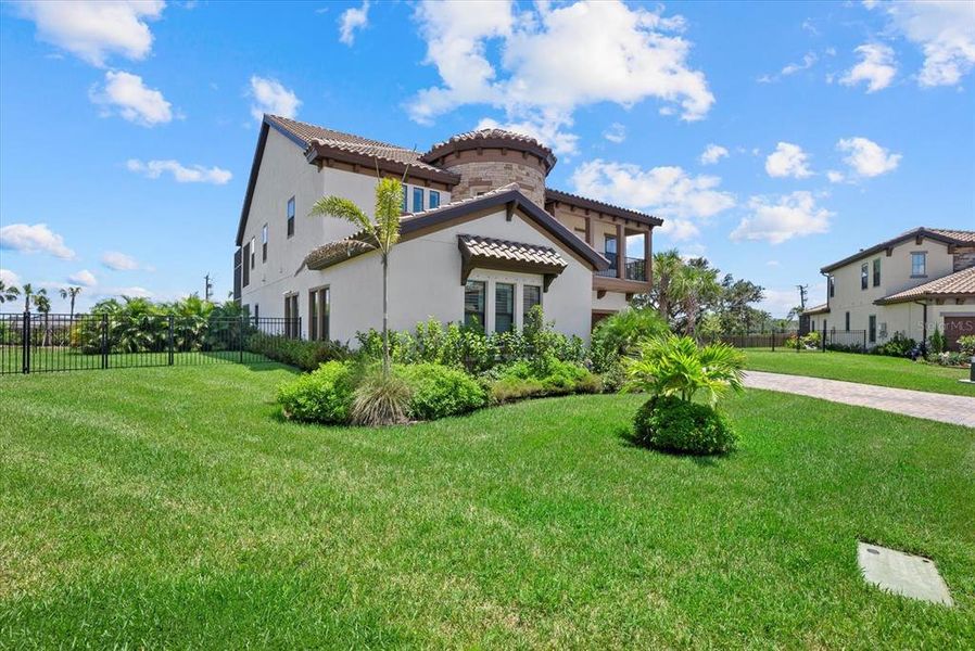 Front exterior of a new home in Crosswind Ranch, Parrish, FL, highlighting curb appeal (Image 22).