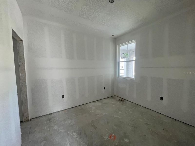 Spacious, unfurnished interior of a new home in Palm Series at Seminole Palms, Palm Coast (Image 12).