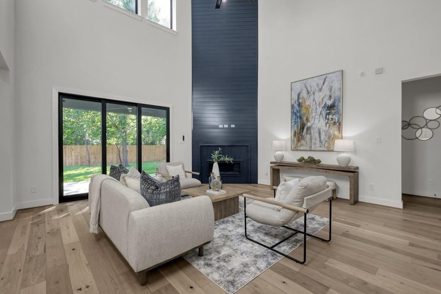 Spacious living room with tall windows and abundant natural light. Spacious living room with tall windows and abundant natural light.