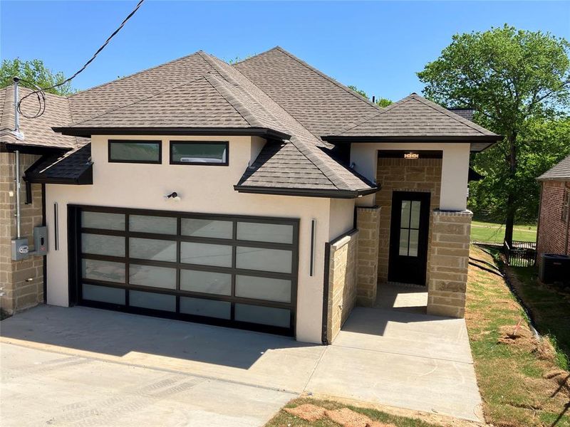 Front exterior of a new home in , Whitney, TX, highlighting curb appeal (Image 14).