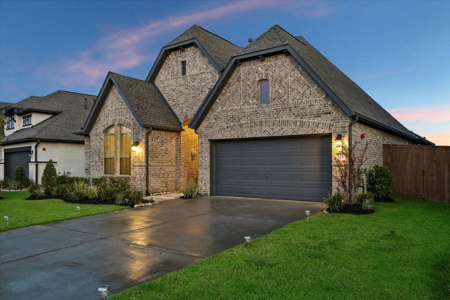 Front exterior of a new home in Edgewater, Webster, TX, highlighting curb appeal (Image 2). Front exterior of a new home in Edgewater, Webster, TX, highlighting curb appeal (Image 2).