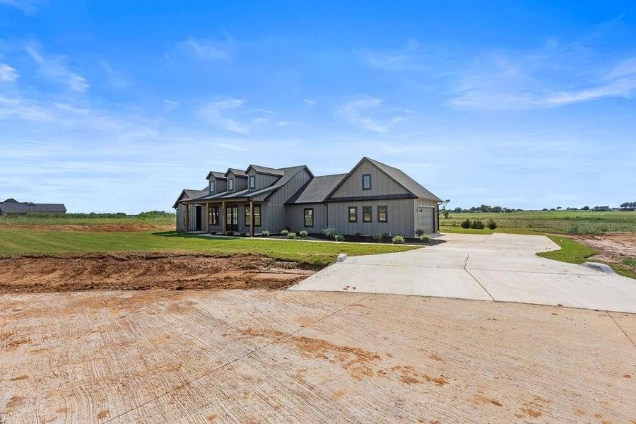 Front exterior of a new home in , Whitesboro, TX, highlighting curb appeal (Image 19). Front exterior of a new home in , Whitesboro, TX, highlighting curb appeal (Image 19).
