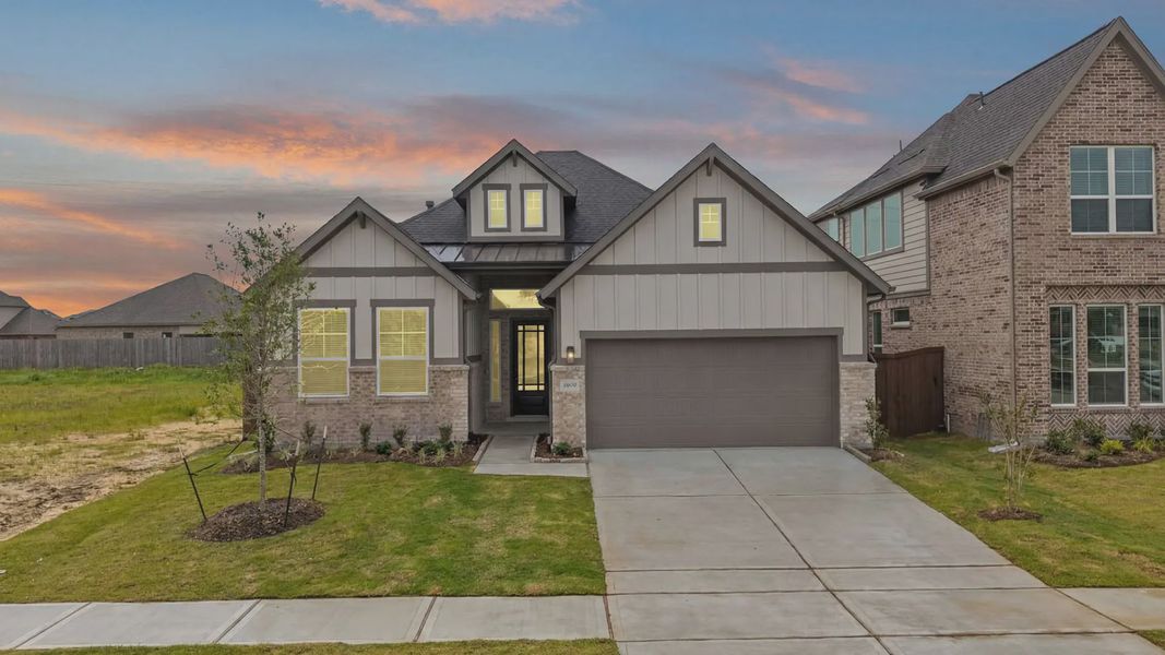 Front exterior of a new home in Blue Heron, Mont Belvieu, TX, highlighting curb appeal (Image 2). Front exterior of a new home in Blue Heron, Mont Belvieu, TX, highlighting curb appeal (Image 2).