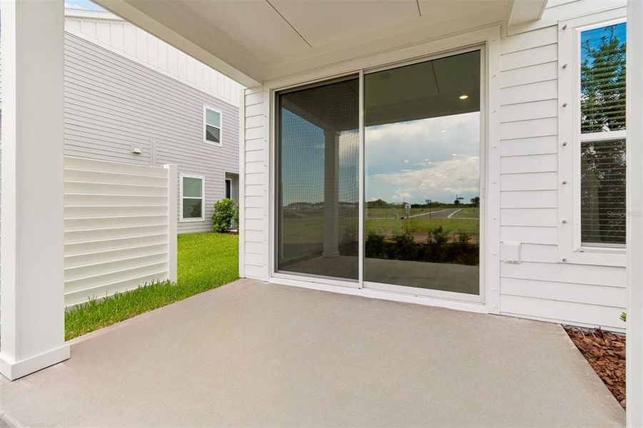 Exterior details and patio area of a home in Waterset Townhomes, Apollo Beach (Image 4).