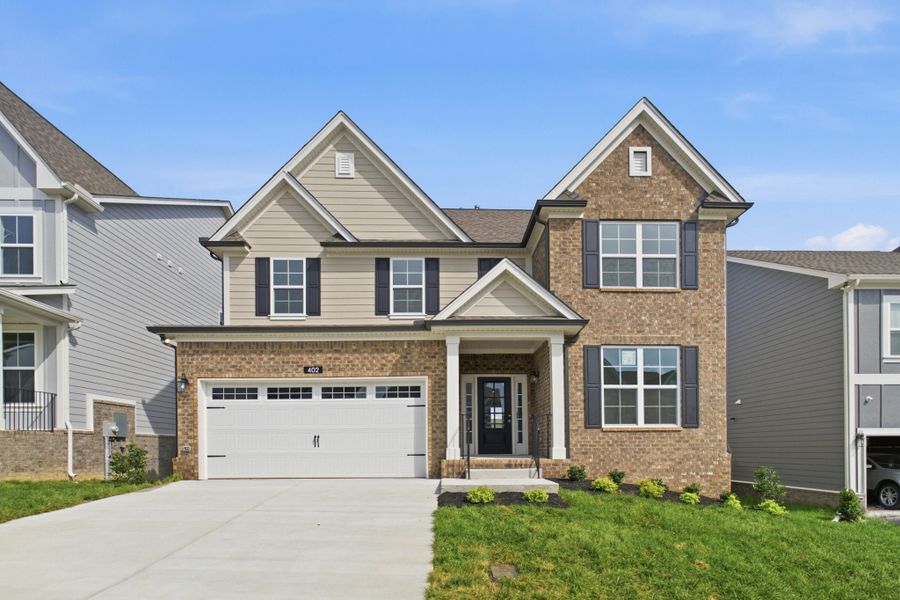Front exterior of a new home in McCain's Station, Gallatin, TN, highlighting curb appeal (Image 1). Front exterior of a new home in McCain's Station, Gallatin, TN, highlighting curb appeal (Image 1).