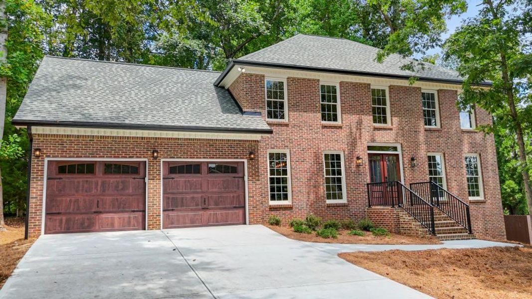 Front exterior of a new home in , Kennesaw, GA, highlighting curb appeal (Image 22).