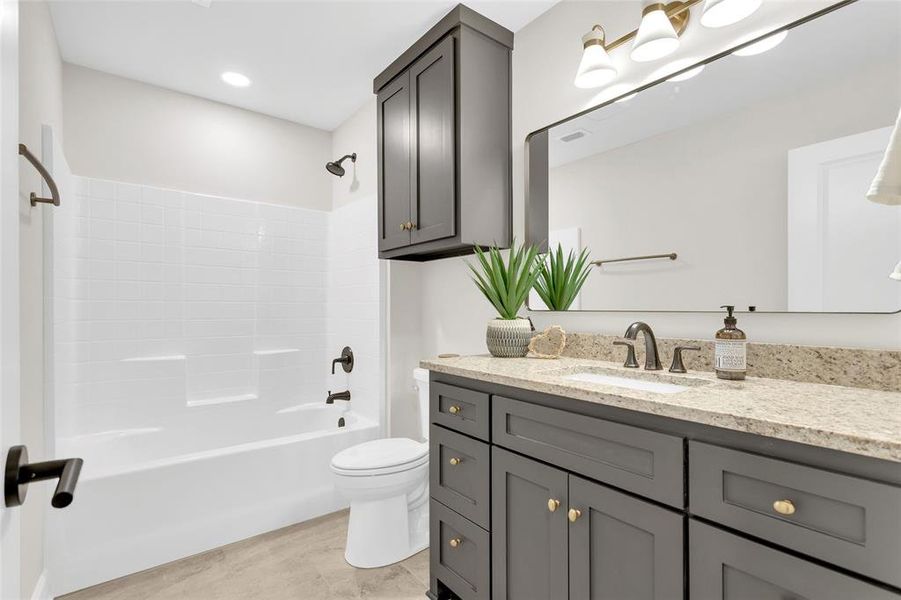 Bathroom with vanity and washtub / shower combination Bathroom with vanity and washtub / shower combination