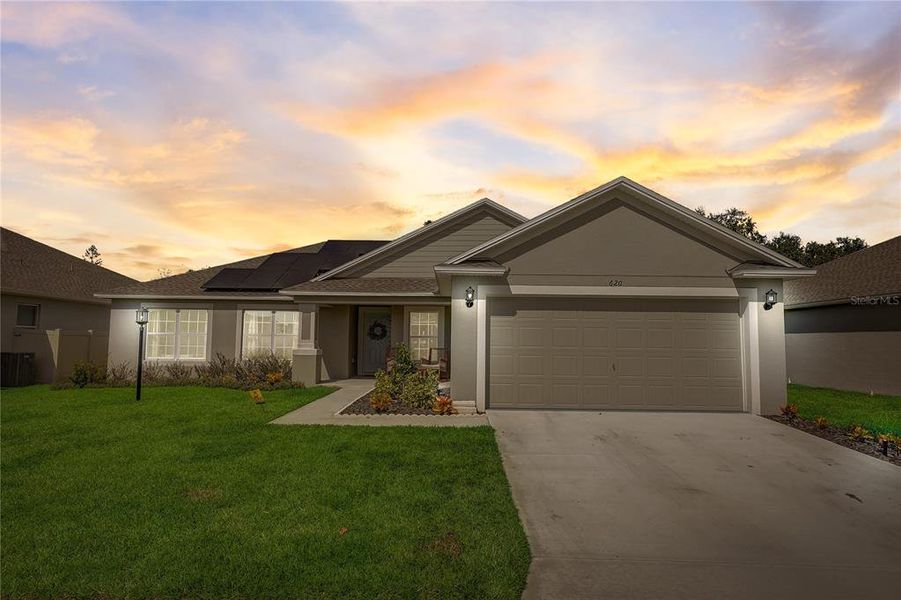 Front exterior of a new home in The Grove At Crystal Beach, Winter Haven, FL, highlighting curb appeal (Image 19). Front exterior of a new home in The Grove At Crystal Beach, Winter Haven, FL, highlighting curb appeal (Image 19).