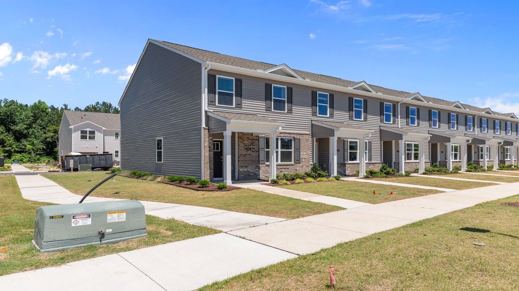 Representative exterior photo of a completed home built from the PEARSON II by D.R. Horton in Clock Road Townhomes, New Bern, NC (Image 26). Representative exterior photo of a completed home built from the PEARSON II by D.R. Horton in Clock Road Townhomes, New Bern, NC (Image 26).