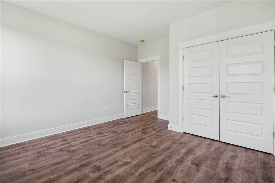 Rich hardwood-style flooring extends across this s