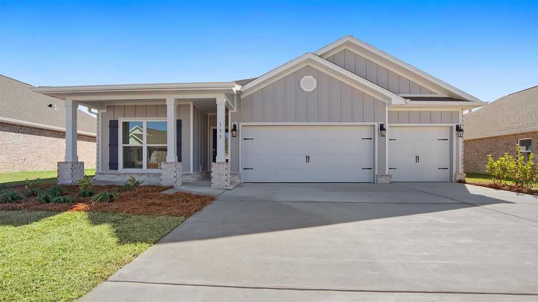 Representative exterior photo of a completed home built from the Madison by D.R. Horton in Owl's Head Farms, Freeport, FL (Image 25).