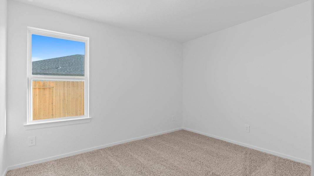 Spacious, unfurnished interior of a new home in Caldwell Crossing, Iowa Colony (Image 15).
