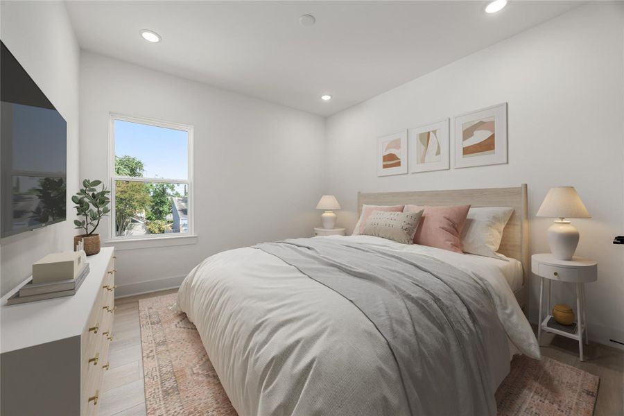 Secondary bedroom features wood like vinyl floors, neutral paint, recessed lighting and a large window with privacy blinds. Secondary bedroom features wood like vinyl floors, neutral paint, recessed lighting and a large window with privacy blinds.