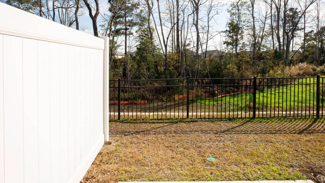 Exterior details and patio area of a home in Waterside Townhomes, Surf City (Image 3).