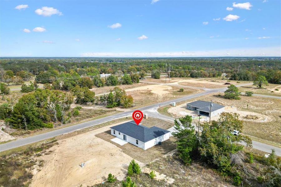 Front exterior of a new home in , Ocklawaha, FL, highlighting curb appeal (Image 2).