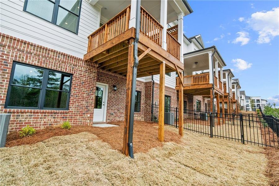 Exterior details and patio area of a home in Millcroft Townhomes, Buford (Image 25).