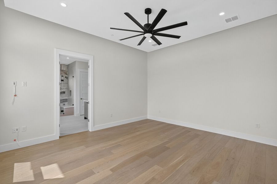 Spacious, unfurnished interior of a new home in Milky Way at River Place, Austin (Image 25).