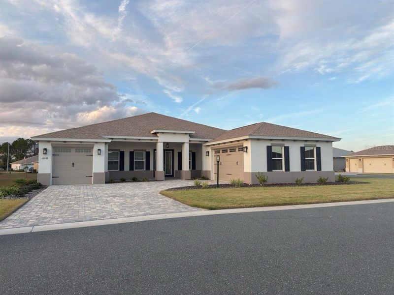 Front exterior of a new home in On Top of the World Communities, Ocala, FL, highlighting curb appeal (Image 1). Front exterior of a new home in On Top of the World Communities, Ocala, FL, highlighting curb appeal (Image 1).