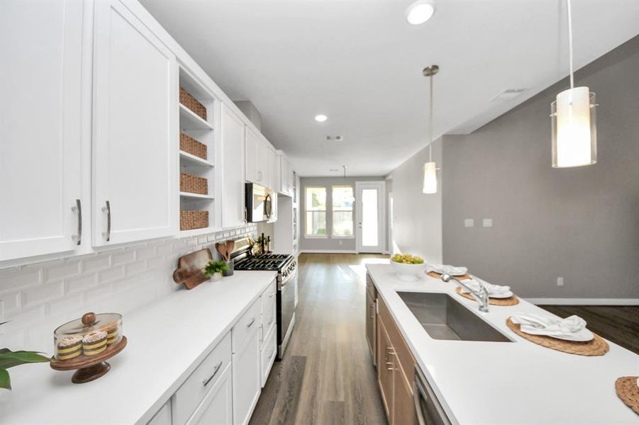 Quartz counters and matte backsplash